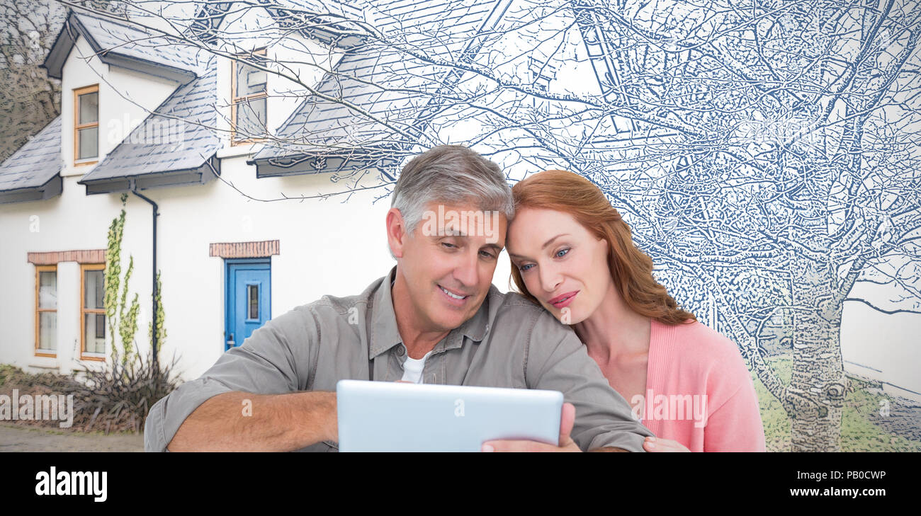 Image composite de casual couple assis à l'aide de tablet Banque D'Images