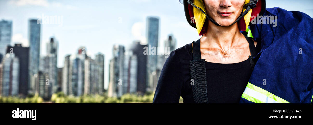 Image composite de female architect wearing helmet against white background Banque D'Images