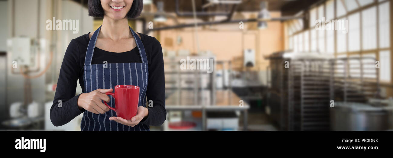 Image composite de smiling waitress holding tasse de café contre fond blanc Banque D'Images