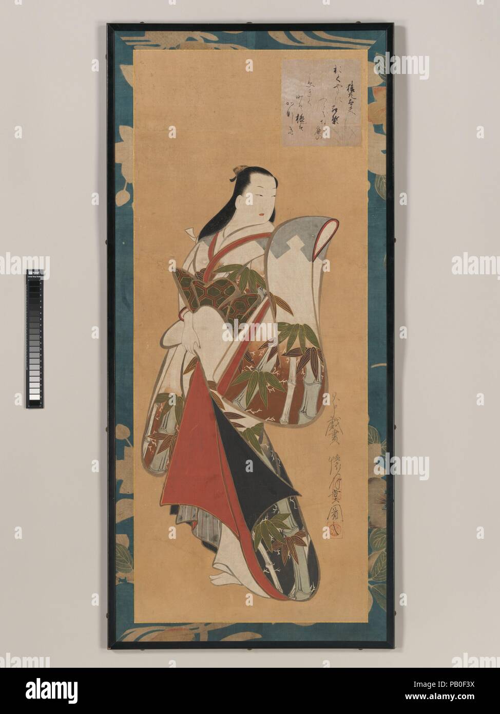 Article courtisane. Artiste : Kaigetsudo Ando (Japonais, ca. 1671-1743). Culture : le Japon. Dimensions : Image : 40 15/16 × 16 5/8 po. (104 × 42,2 cm) dans l'ensemble avec support de montage : 44 7/8 × 20 1/2 in. (114 × 52 cm). Date : début du 18e siècle. Une courtisane, sculpturales et regal à poser, a interrompu sa procession à une rétrospective, peut-être de reconnaître un admirateur. Kaigetsudo Ando est le fondateur d'un studio d'artistes qui ont produit des peintures et gravures de la femme de haut rang du demimonde. Ici un poème (carte de shikishi) est inscrit sur un poème attribué à Sarumaru Dayu (actif fin du viiie siècle) Banque D'Images