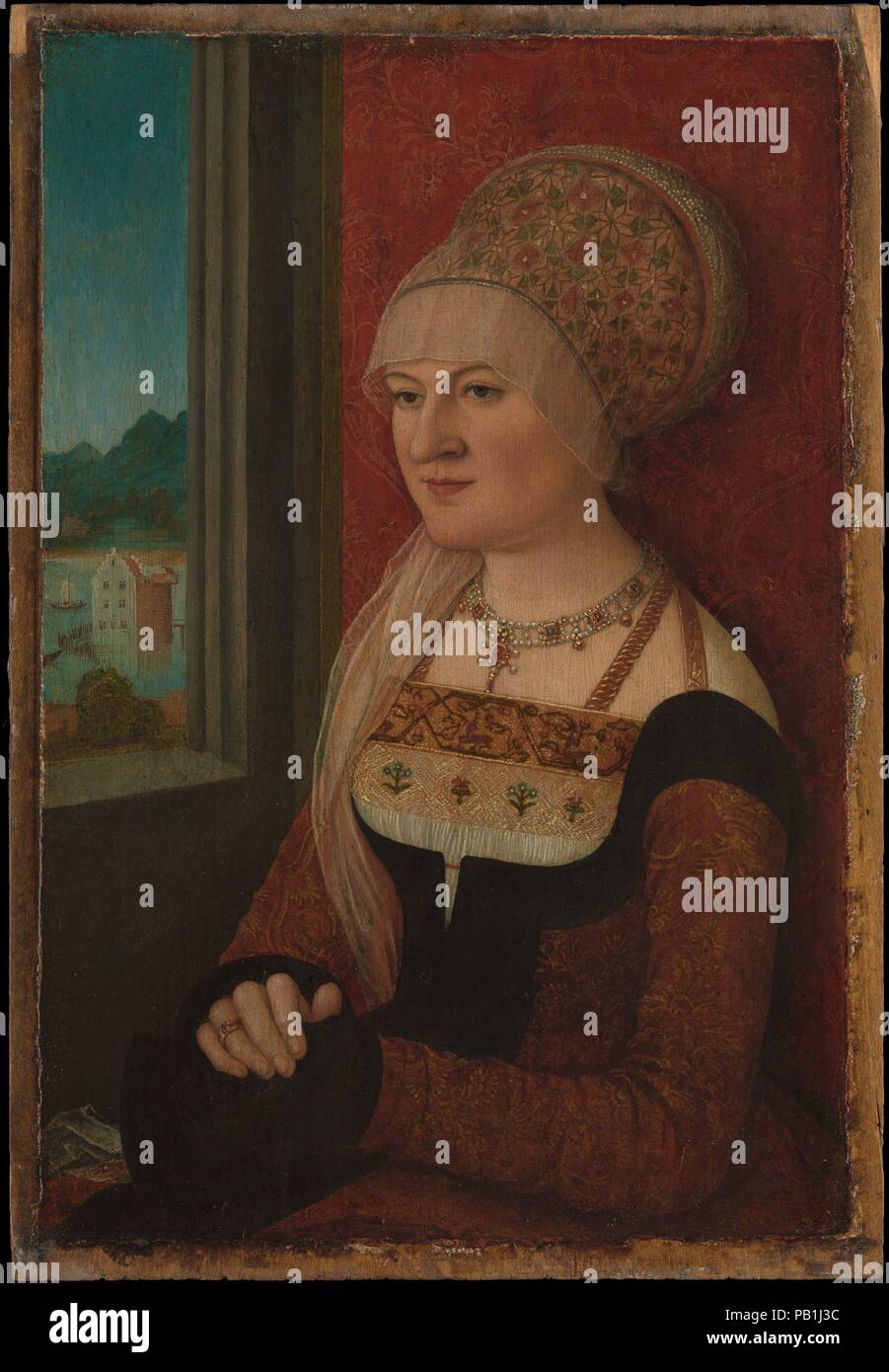 Portrait d'une femme. Artiste : Bernhard Strigel (allemand, Memmingen Memmingen 1460-1528). Dimensions : 15 1/8 x 10 1/2 in. (38,4 x 26,7 cm). Date : ca. 1510-15. Bernhard Strigel appartenait à une famille d'artistes qui ont fleuri après le milieu du xve siècle dans la ville de Memmingen, près de la frontière suisse. Dans les deux premières décennies du 16e siècle, il a produit un certain nombre de portraits de dames en robe extravagante placé avant un décoratif brocart pendaison avec une fenêtre ouverte en vue d'un paysage. La jeune femme dans cette (probablement) portrait indépendant n'a pas été identifié, Banque D'Images
