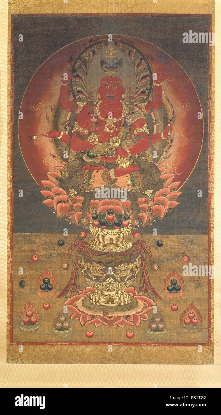 Aizen Myoo. Culture : le Japon. Dimensions : 53 x 32 5/16 7/16 in. (135,4 x 82,4 cm). Date : le 14e siècle. Le corps rouge-sang et flaming halo de Aizen Myoo, la sagesse roi de Passion, symbolisent la manière dont, dans la pratique bouddhiste, les énergies de violence et de désir charnel peut être converti dans la poursuite de l'illumination. Aizen Myoo est l'incarnation de rage : ses cheveux se dresse sur fin, ses crocs d'un lion s'élève de sa tête, et ses six bras brandissent des armes bouddhiste ésotérique et autres emblèmes du pouvoir. L'arc et de la flèche dans son milieu mains sont des attributs affectés de Kama, le dieu hindou de l'amour. En contr Banque D'Images
