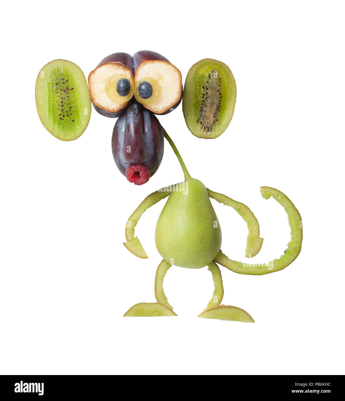 Funny monkey fait avec prune, poire et kiwi Banque D'Images