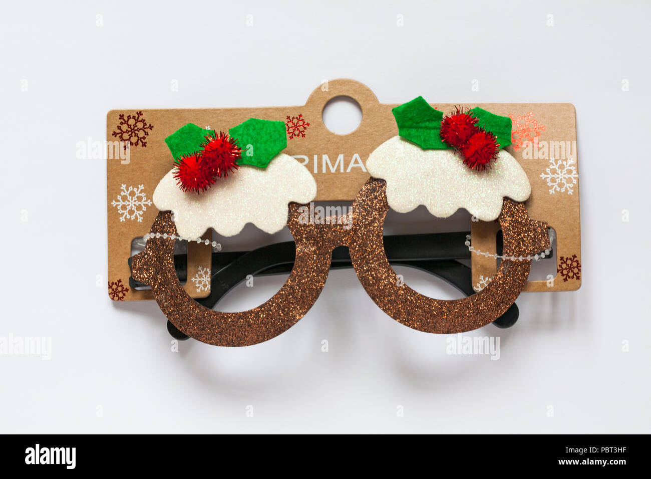 Primark Novelty Christmas Pudding lunettes scintillantes pour Noël isolé sur fond blanc Banque D'Images