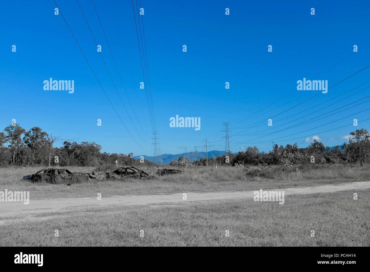 Les lignes électriques et les tours à parcourir le paysage australien, Townsville, Queensland, Australie Banque D'Images