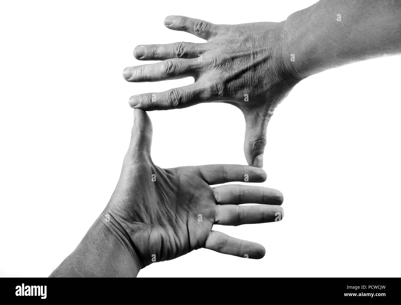 Des mains s'inscrivent sur un fond blanc en noir et blanc. Banque D'Images