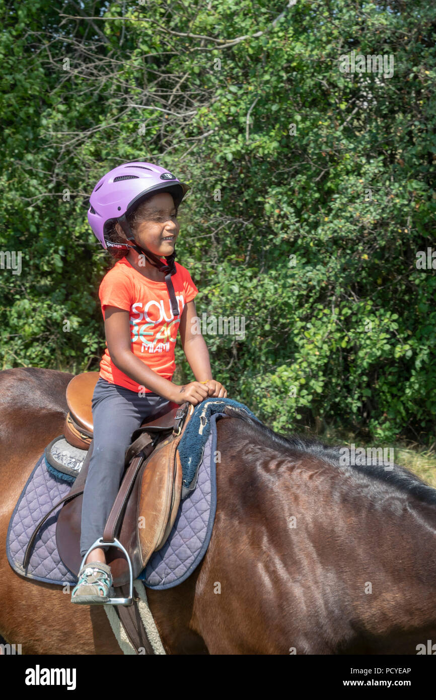 Detroit, Michigan - Les enfants ont eu la chance de rouler et d'apprendre sur les chevaux à un parc de la ville. L'événement a été organisé par Detroit, une puissance organizati Banque D'Images