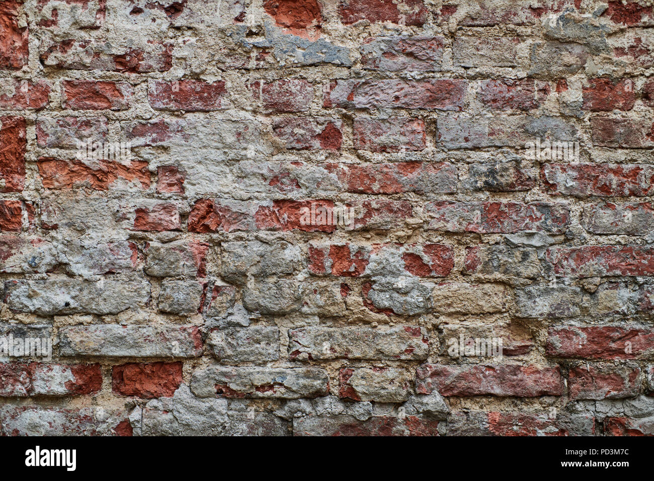 Vieux mur de briques rouges et blanches avec arrière-plan. Banque D'Images