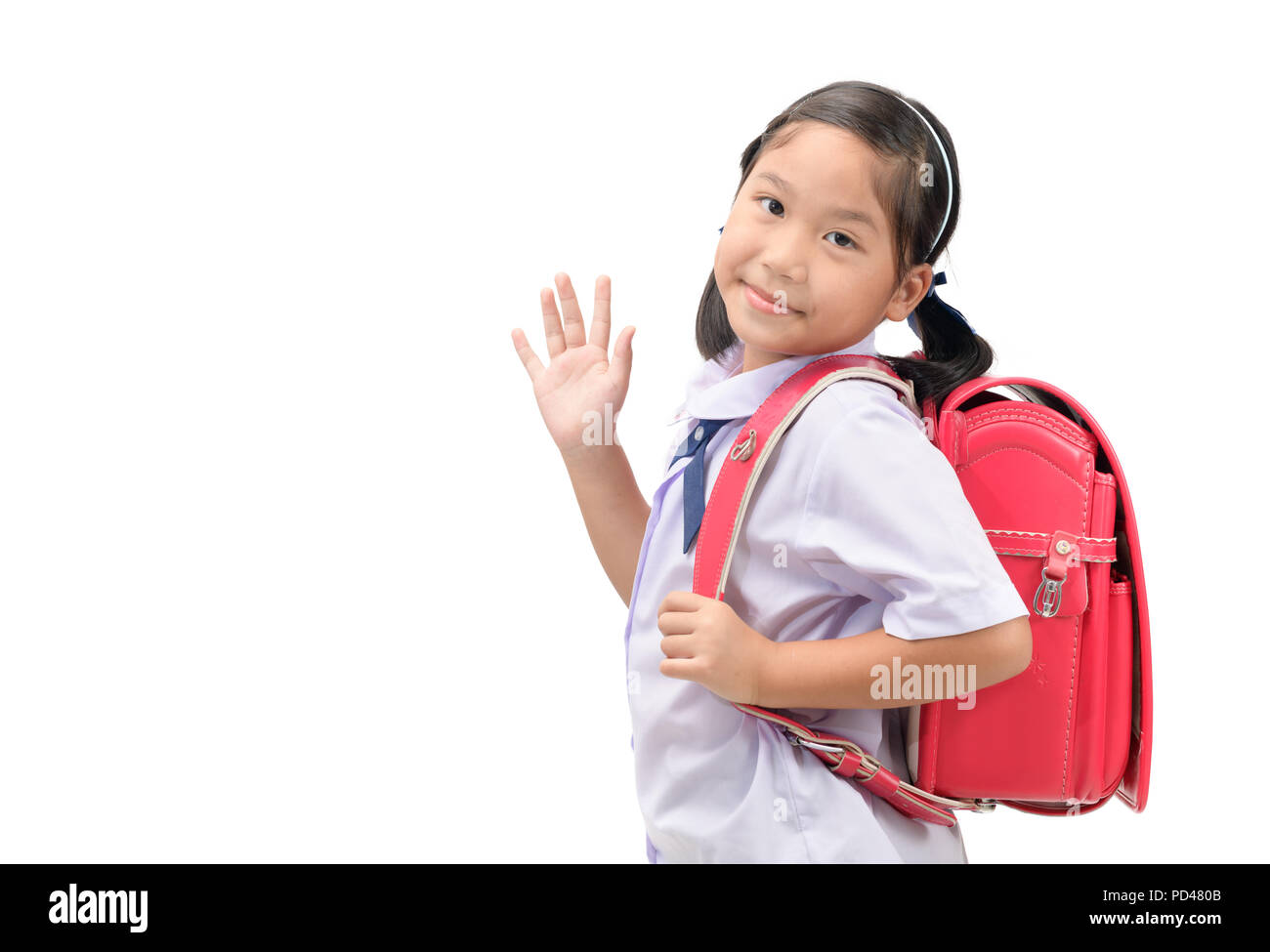 Asian girl student aller à l'école et salué isolé sur fond blanc, concept retour à l'école Banque D'Images