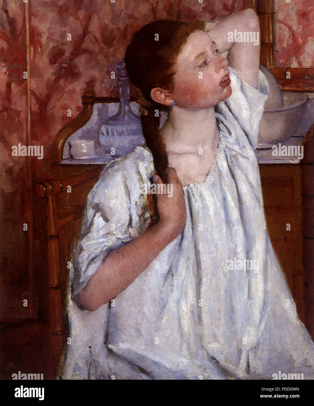 L'organisation de ses cheveux, fille, Mary Cassatt, 1886. Banque D'Images