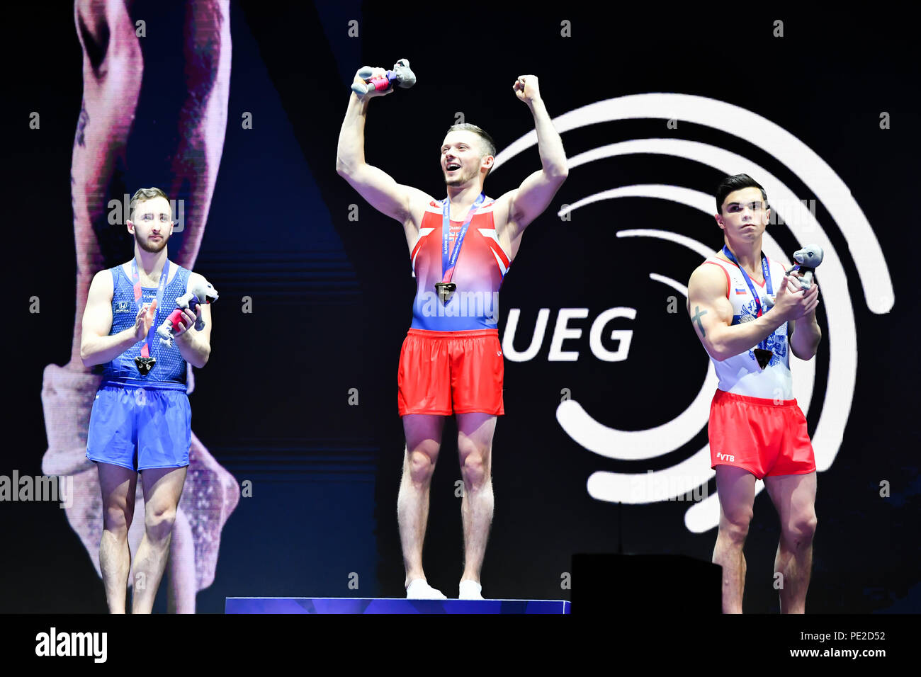 Glasgow, Ecosse, Royaume-Uni. 12 août 2018. Dominick CUNNINGHAM (GBR) - or, DOLGOPYAT Artem (ISR) - Argent et DALALOYAN Artur (RUS) -Présentation du gagnant au bronze après avoir participé à l'exercice au sol les appareils de gymnastique artistique masculine pendant la phase finale des Championnats d'Europe 2018 Glasgow à l'Hydro SSE le dimanche, 12 août 2018. GLASGOW EN ÉCOSSE. Credit : Crédit : Wu G Taka Taka Wu/Alamy Live News Banque D'Images