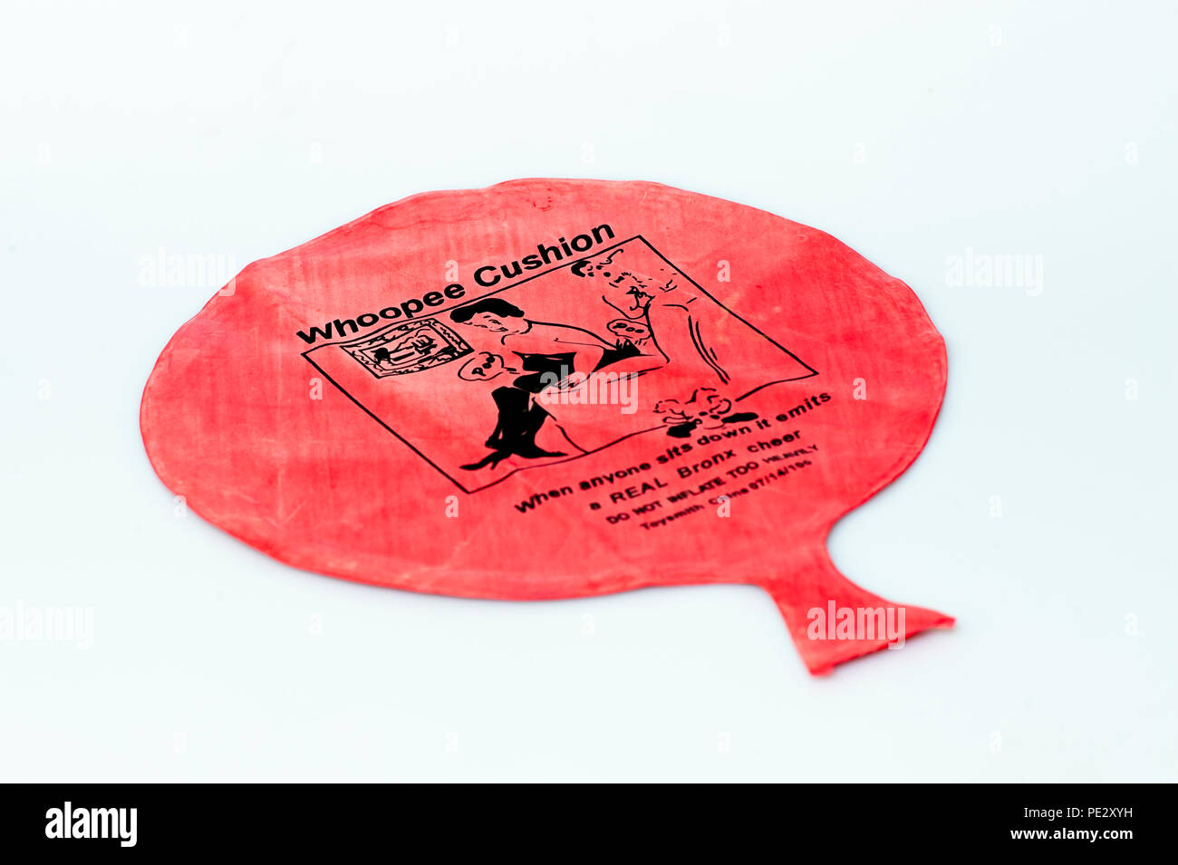 Un coussin rouge nouveauté Whoopee faite pour les gag et astuces pour de faux bruits de pet Banque D'Images