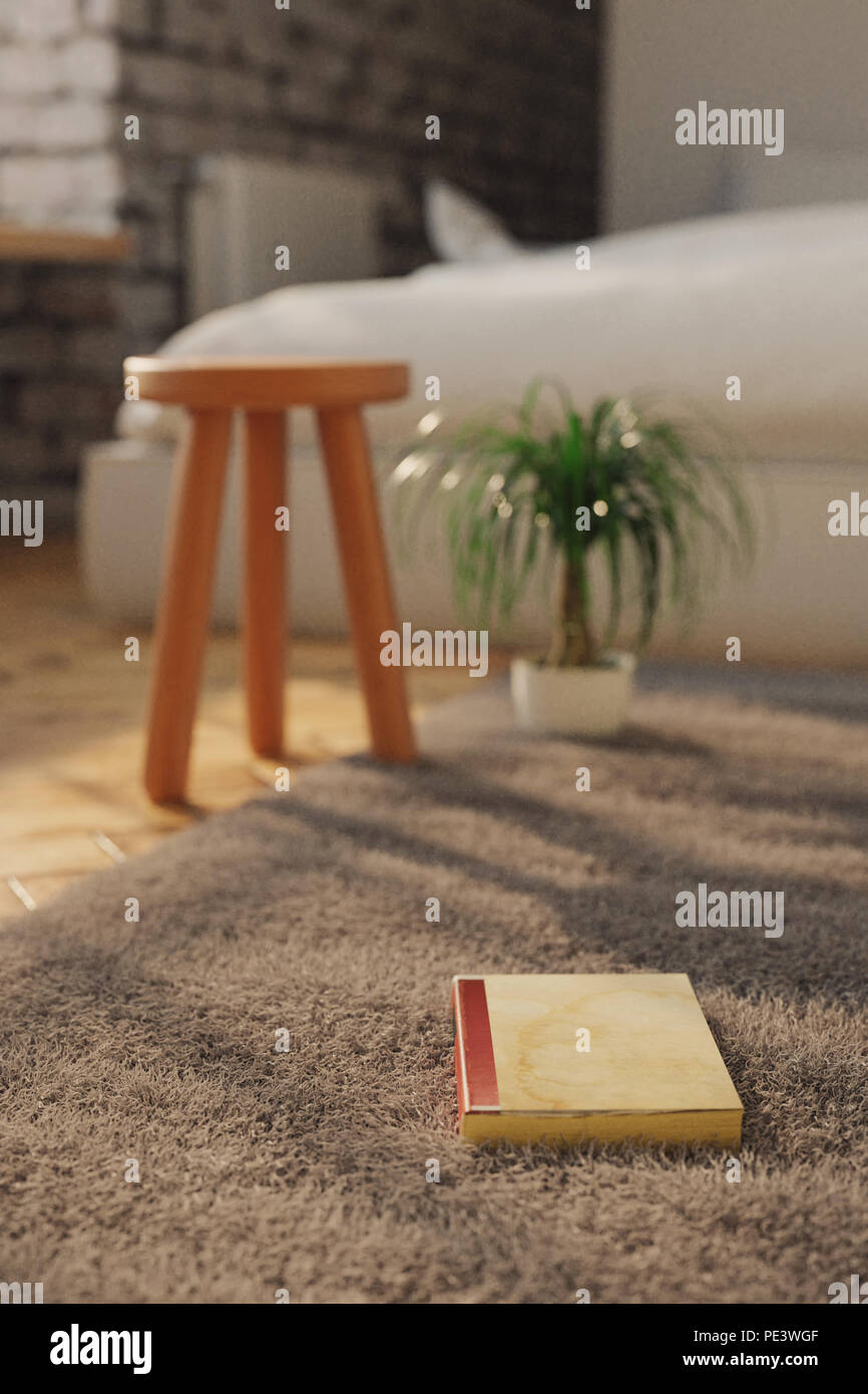 Le rendu 3D de vieux livre sur tapis à coucher dans le soleil Banque D'Images