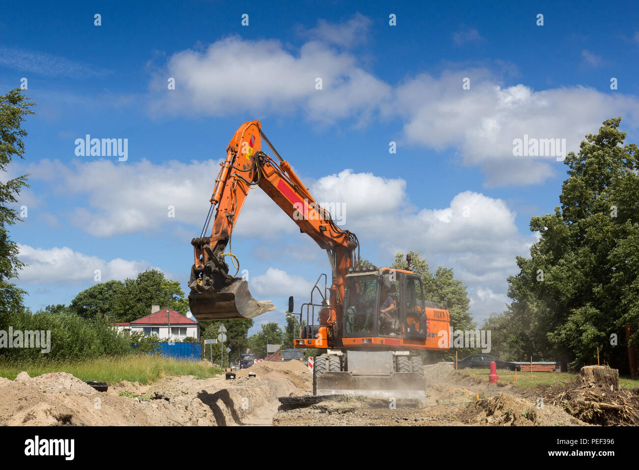 Les travaux sur le site de construction de l'excavateur Banque D'Images