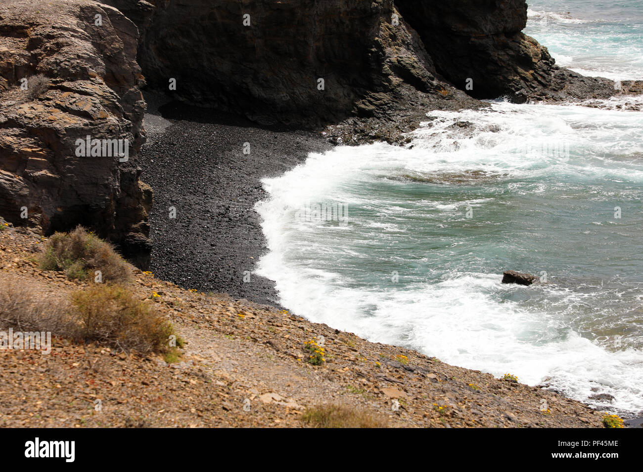 De sable et de galets noirs en Playas plages de Papagayo, Lanzarote Island, Espagne Banque D'Images