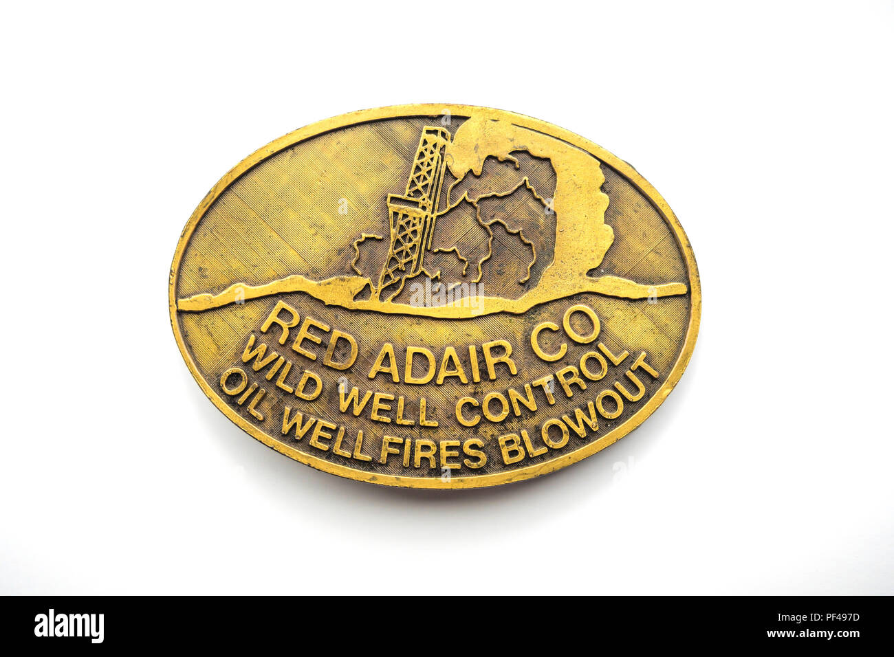Boucle de laiton AA du matériel publicitaire de la société Red Adair Wild Well Control incendies des puits de pétrole et d'une éruption Banque D'Images