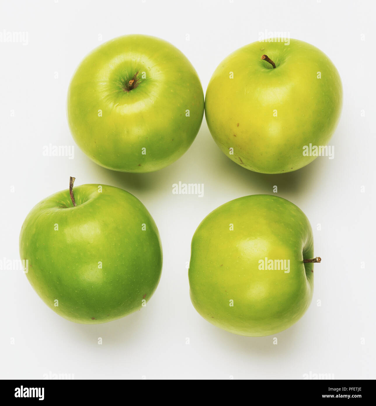 4 pommes vertes Photo Stock - Alamy