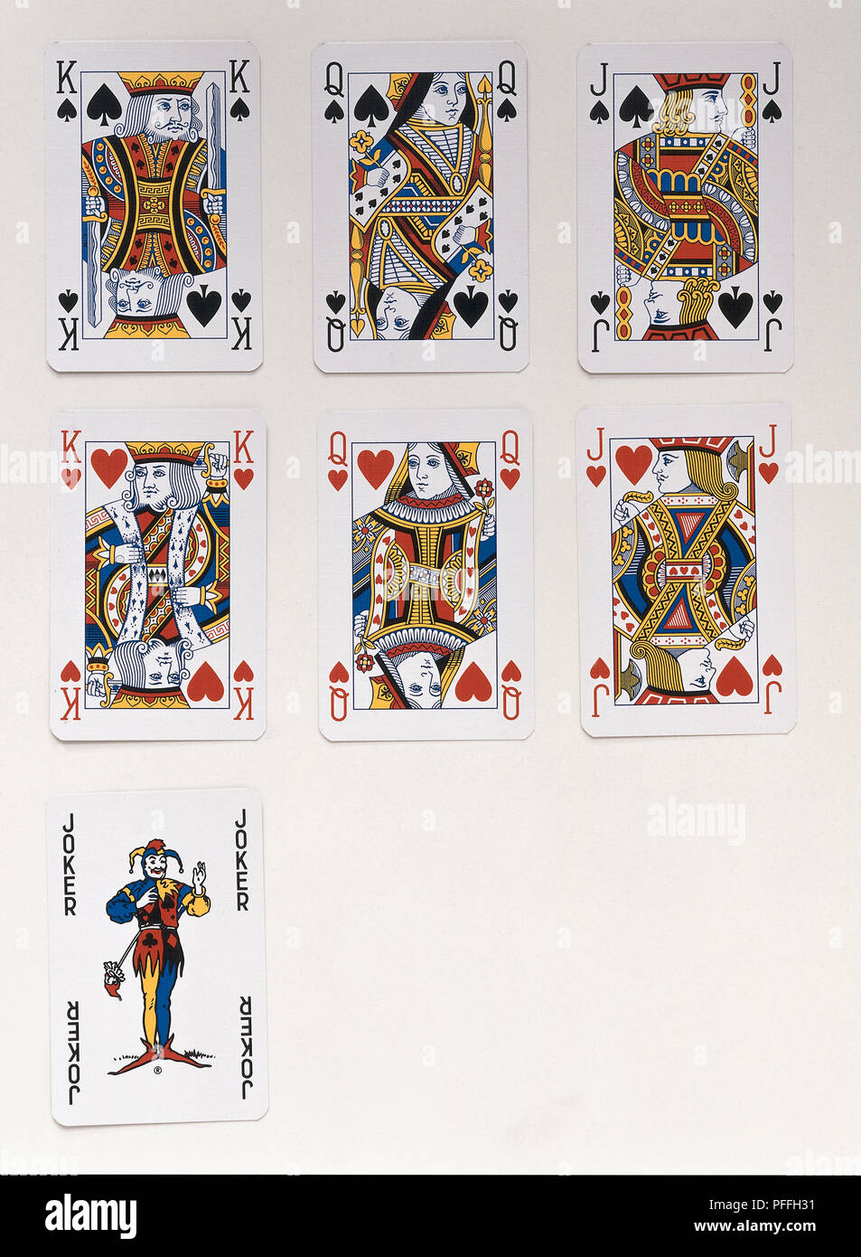 Des cartes à jouer, y compris un roi, reine et valet de coeur et de pique et d'un joker Banque D'Images