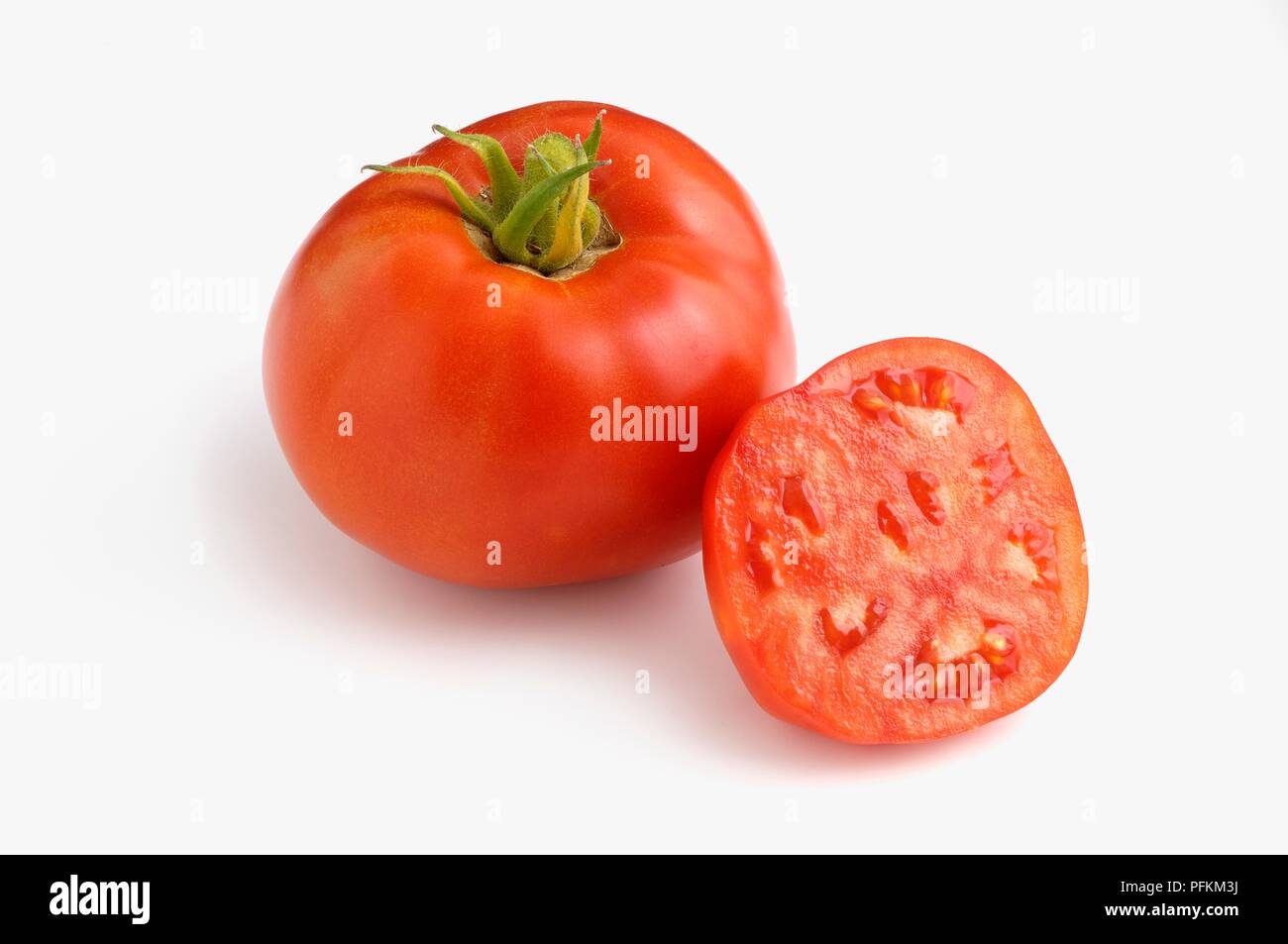 Ensemble et les tranches de tomate Légende rouge américain Banque D'Images