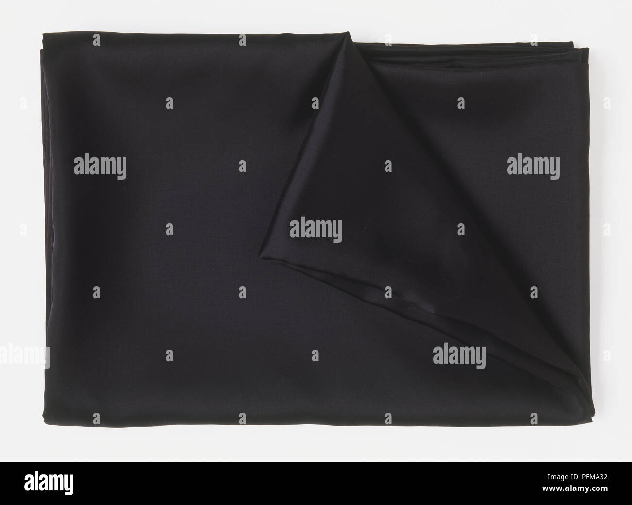 Tissu noir plié Banque D'Images