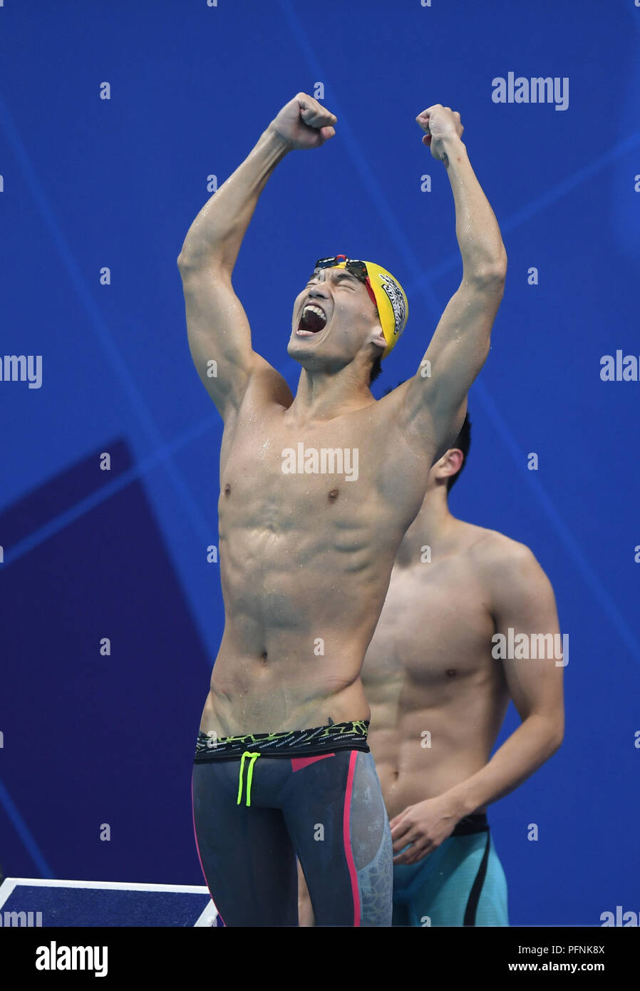 Jakarta, Indonésie. Août 22, 2018. Jiayu Xu de Chine célèbre après avoir mélangé 4x100m relais quatre nages finale de natation au 18e Jeux asiatiques à Jakarta, Indonésie, le 22 août, 2018. La Chine a remporté la médaille d'or. Credit : Yue Yuewei/Xinhua/Alamy Live News Banque D'Images