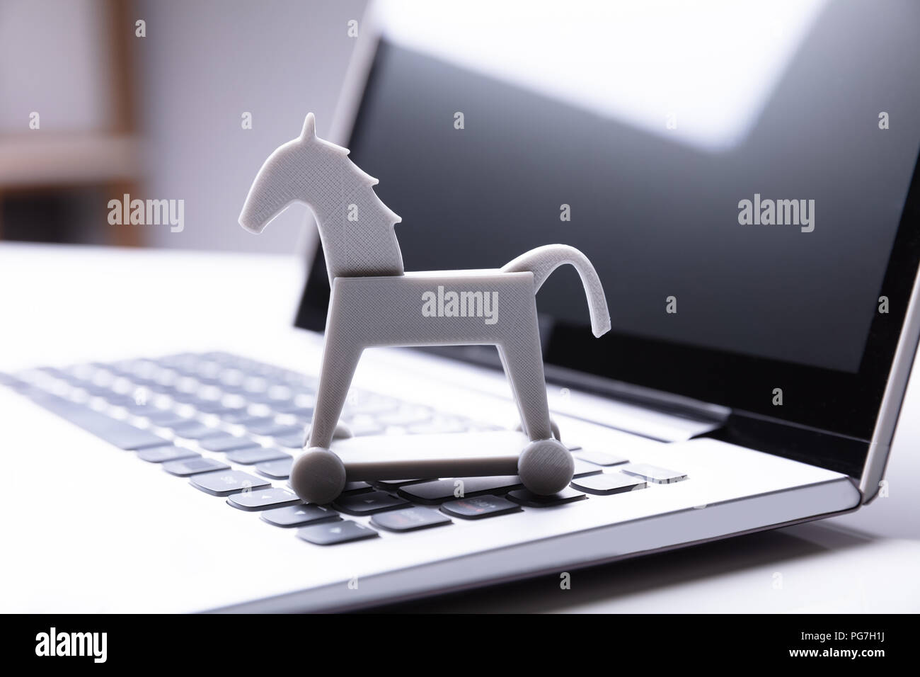 Close-up de cheval de Troie sur l'icône du clavier d'ordinateur portable Banque D'Images