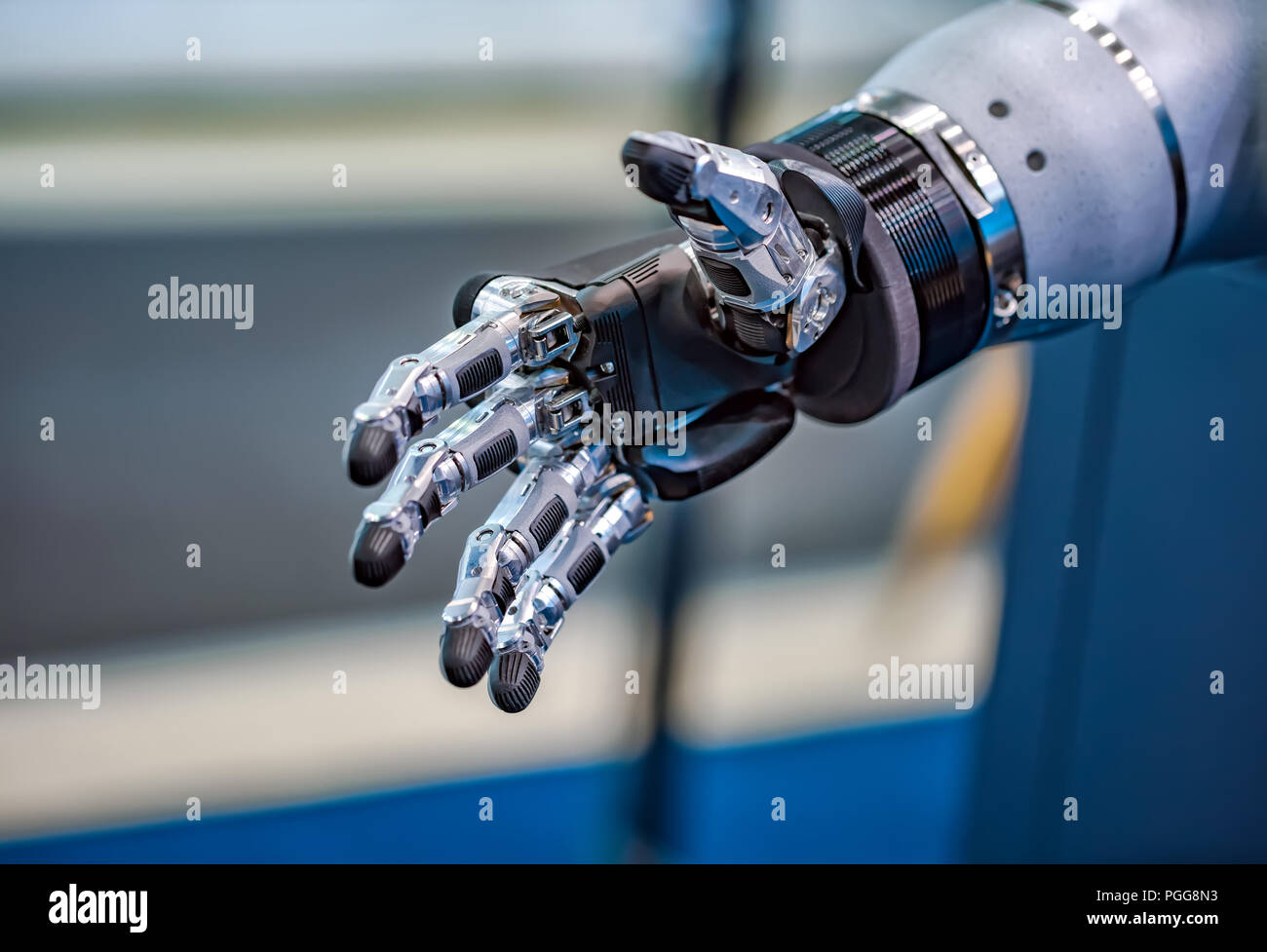 La main robotique futuriste pour une poignée de main Banque D'Images
