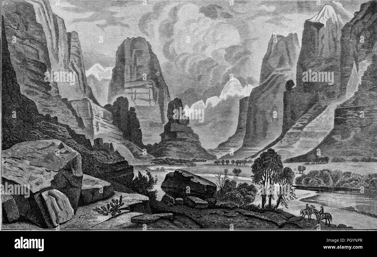 Tirage d'époque en noir et blanc représentant le fleuve Colorado (ou un affluent) serpentant à travers un large canyon avec de grandes buttes imminente dans l'arrière-plan, situé dans l'Utah, USA, et publié dans William Makepeace Thayer's 'Marvels volume du nouvel Ouest', 1887. Avec la permission de Internet Archive. () Banque D'Images