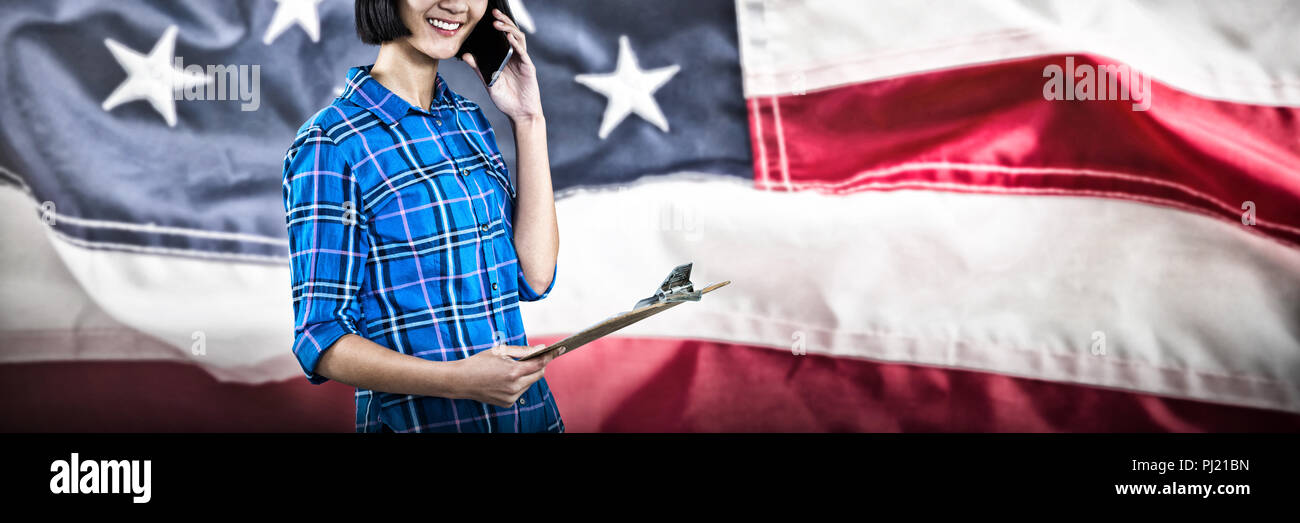 Image composite de female architect talking on mobile phone Banque D'Images