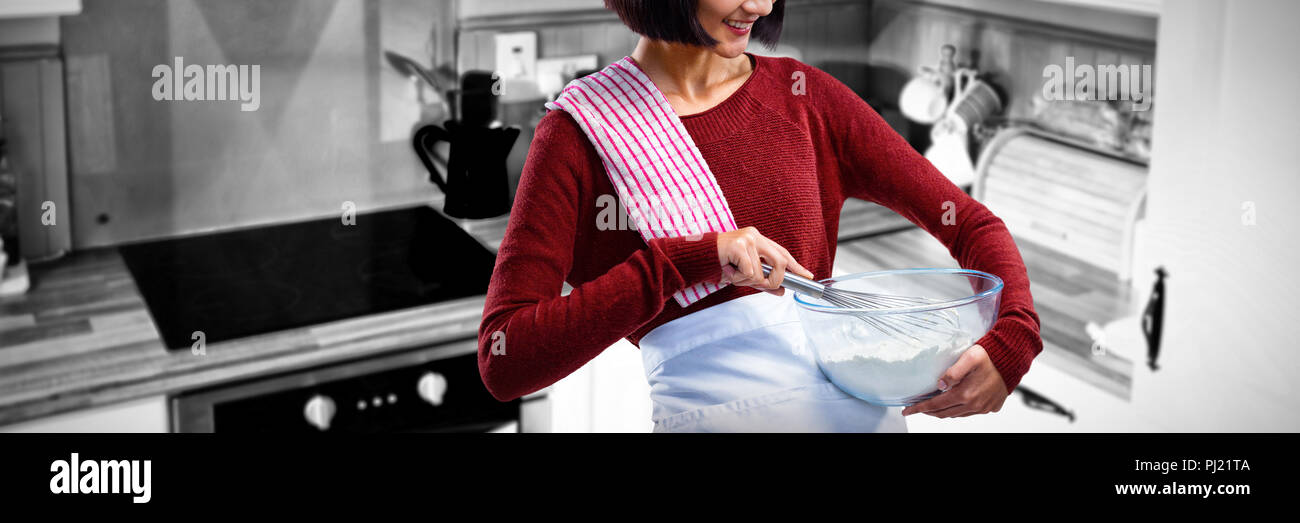 Image composite de femme chef de la farine en mélangeant au fouet bol Banque D'Images