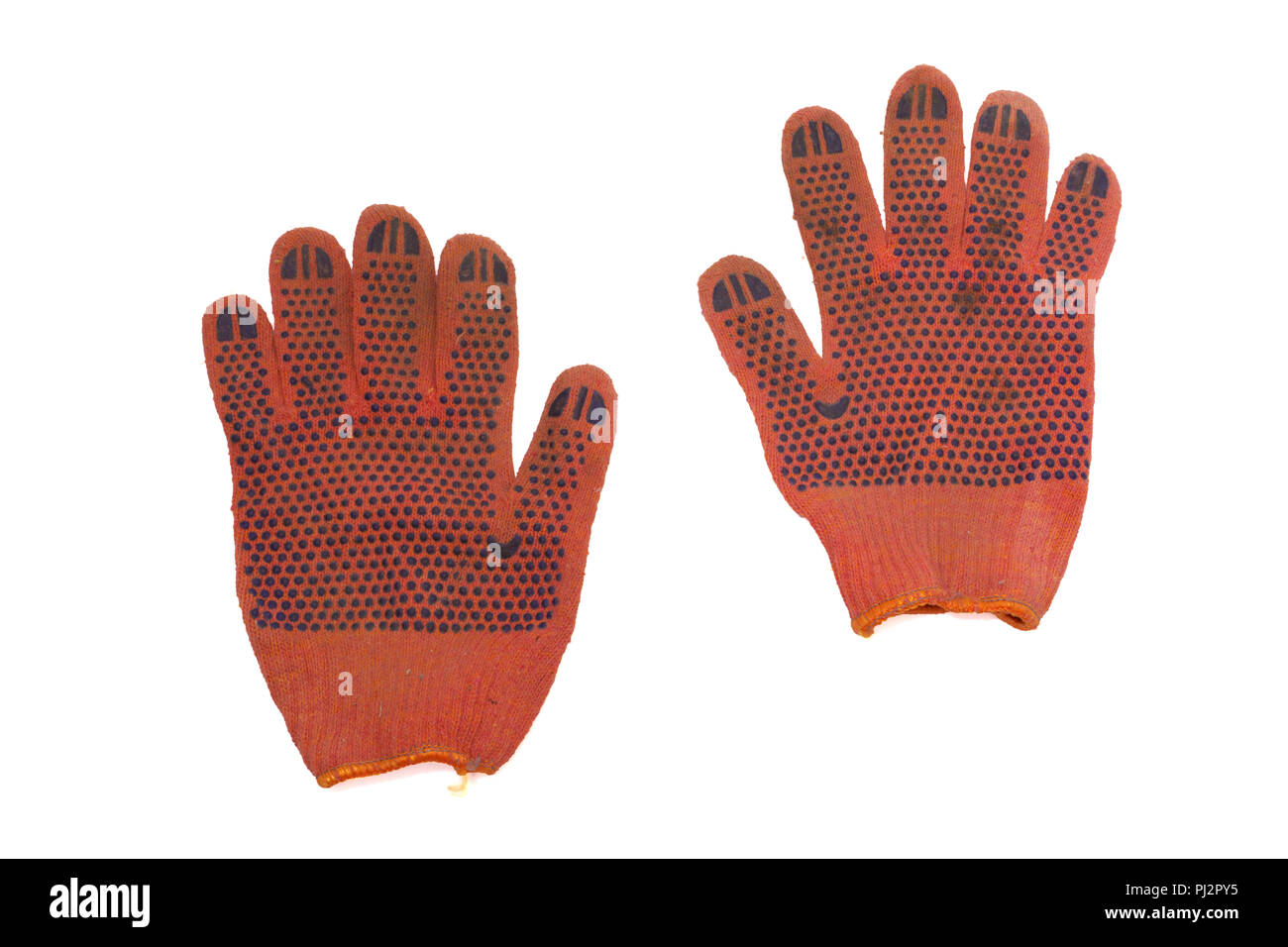 Paire de gants de protection orange. couvert par le côté de travail en caoutchouc antidérapant points. isolé, clipping path Banque D'Images