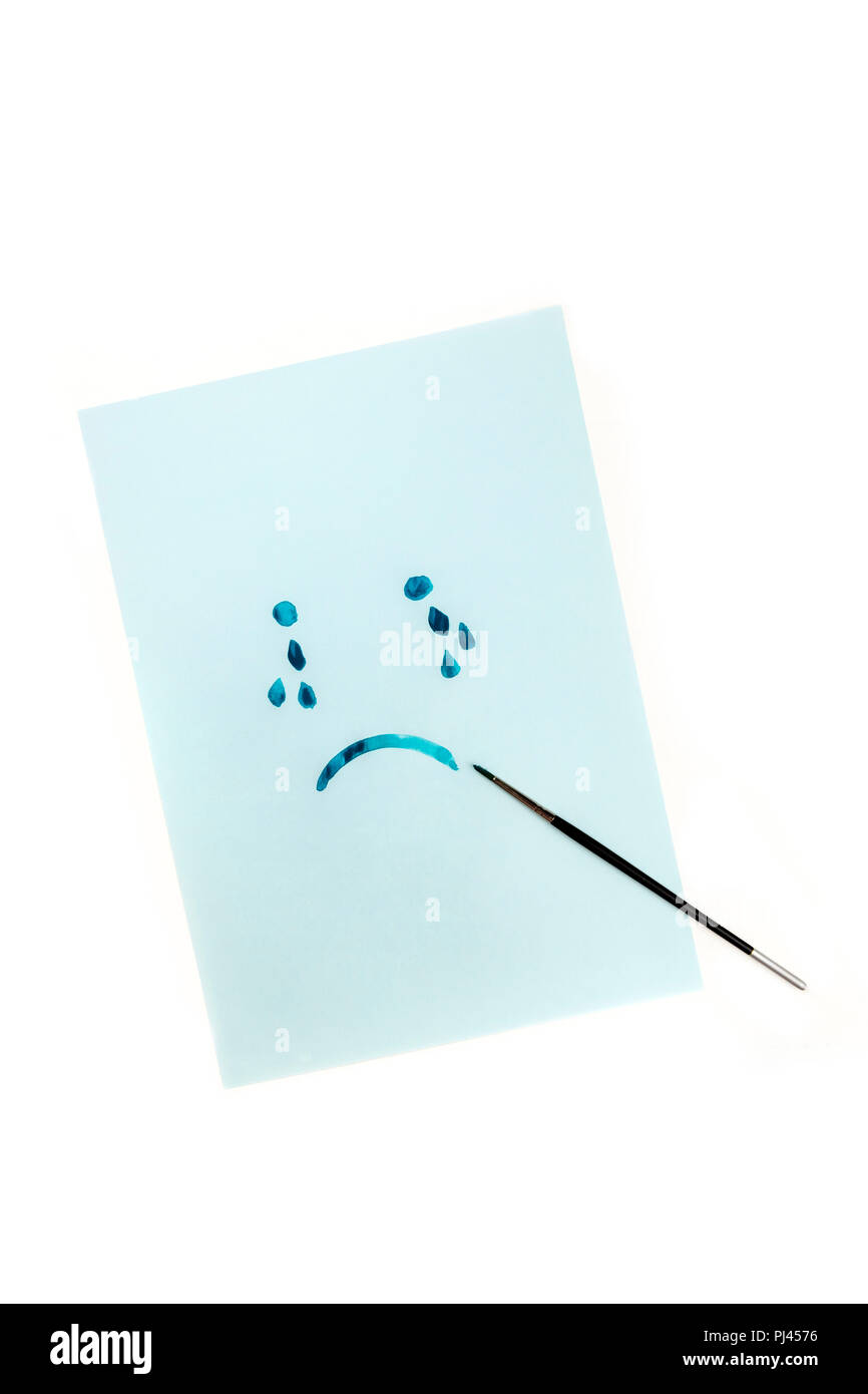 Bleu, visage triste avec des larmes, peintes à la main sur du papier bleu à l'aquarelle, la dépression concept, avec copyspace Banque D'Images