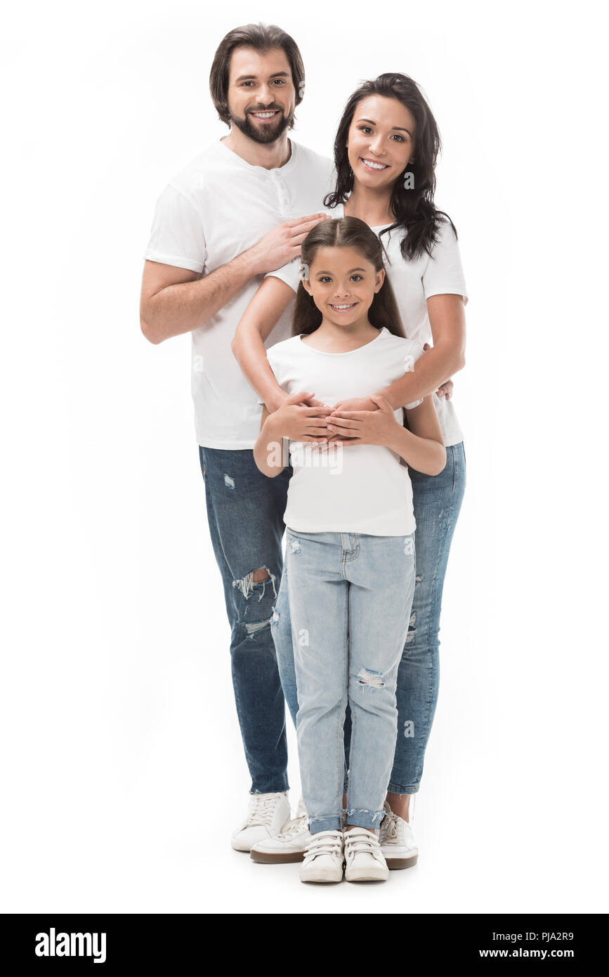 Famille heureuse en chemise blanche et jeans isolated on white Banque D'Images