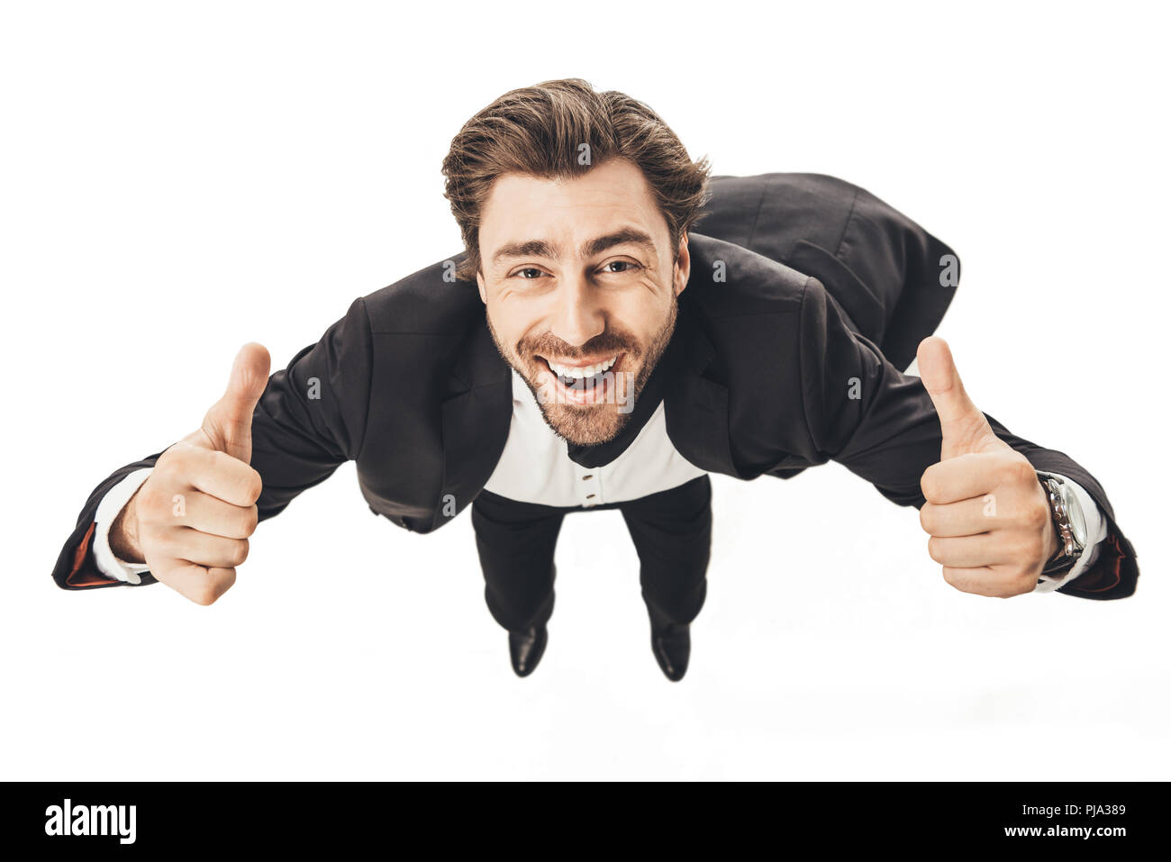 Close-up shot of young businessman falling et showing Thumbs up isolated on white Banque D'Images