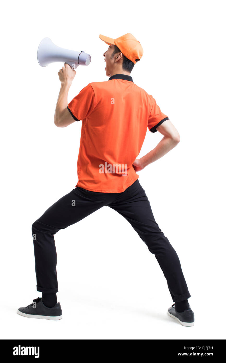 Cheerful livreur de pizza crier par mégaphone Banque D'Images Cheerful livreur de pizza crier par mégaphone Banque D'Images