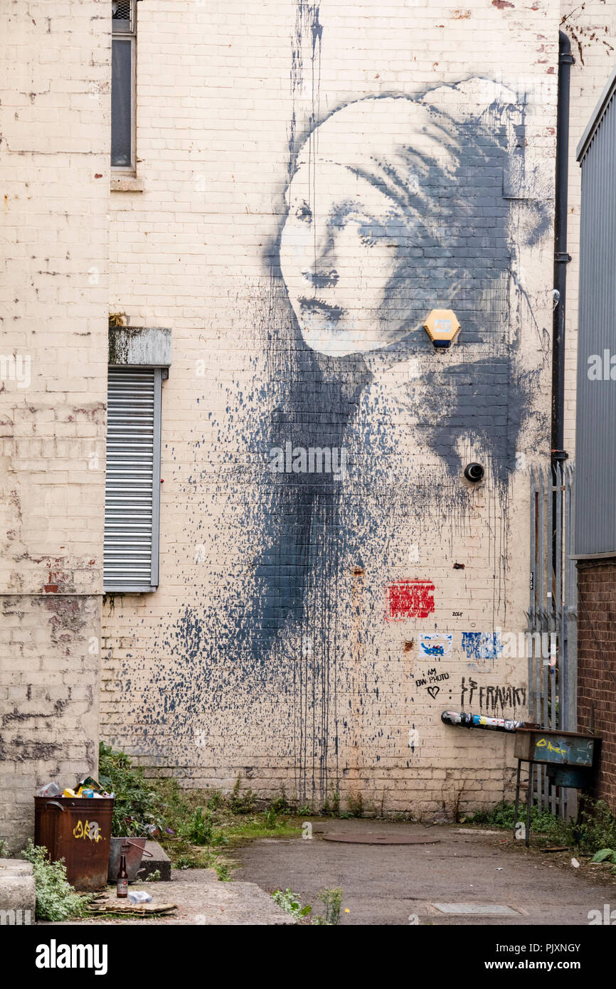 La jeune fille avec un tympan percé, l'art de mur à Bristol, Angleterre, Royaume-Uni Banque D'Images