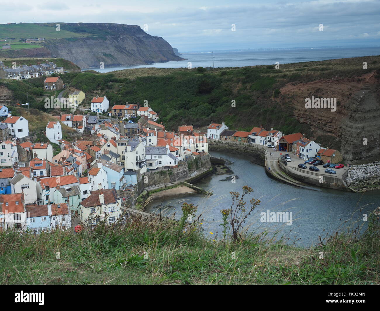 Whitby, Stathes et Robin Hood's Bay, sur la côte est, dans le Yorkshire du Nord des marines et des paysages pendant le lever du soleil. Banque D'Images