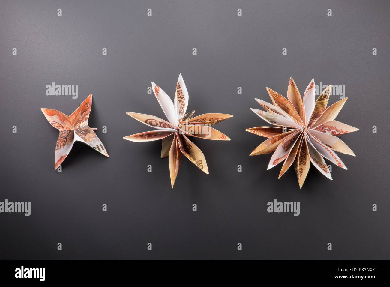 Billets origami fleurs Banque D'Images
