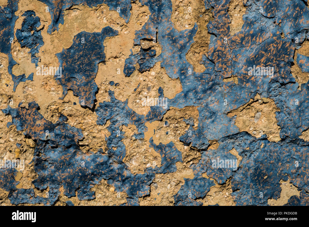 Mur en pierre jaune et bleu foncé peinture pèle du mur/grunge texture background Banque D'Images