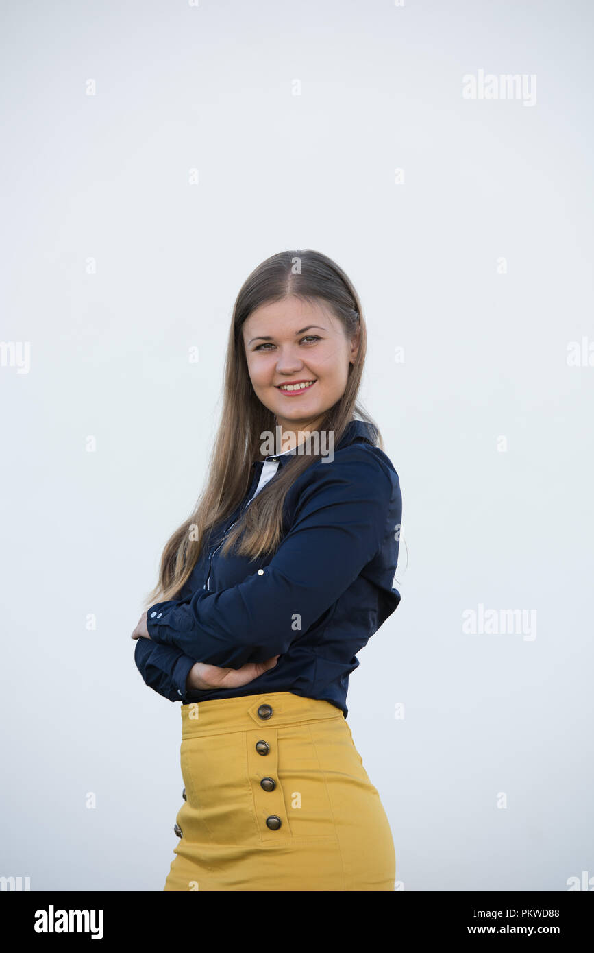 Happy business woman in front on white background Banque D'Images