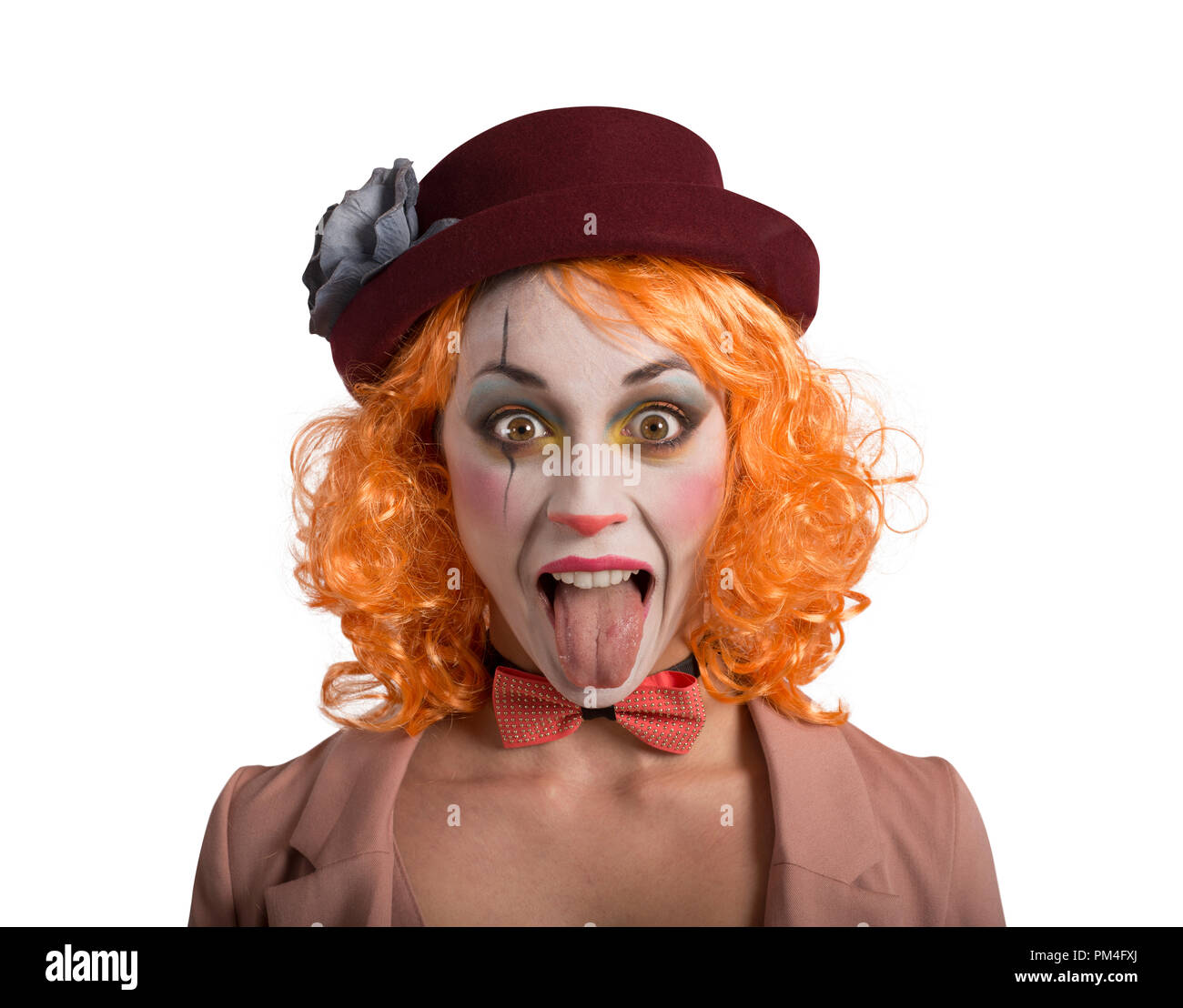 Grimace drôle de fille de fille de clown avec la langue à l'extérieur Banque D'Images