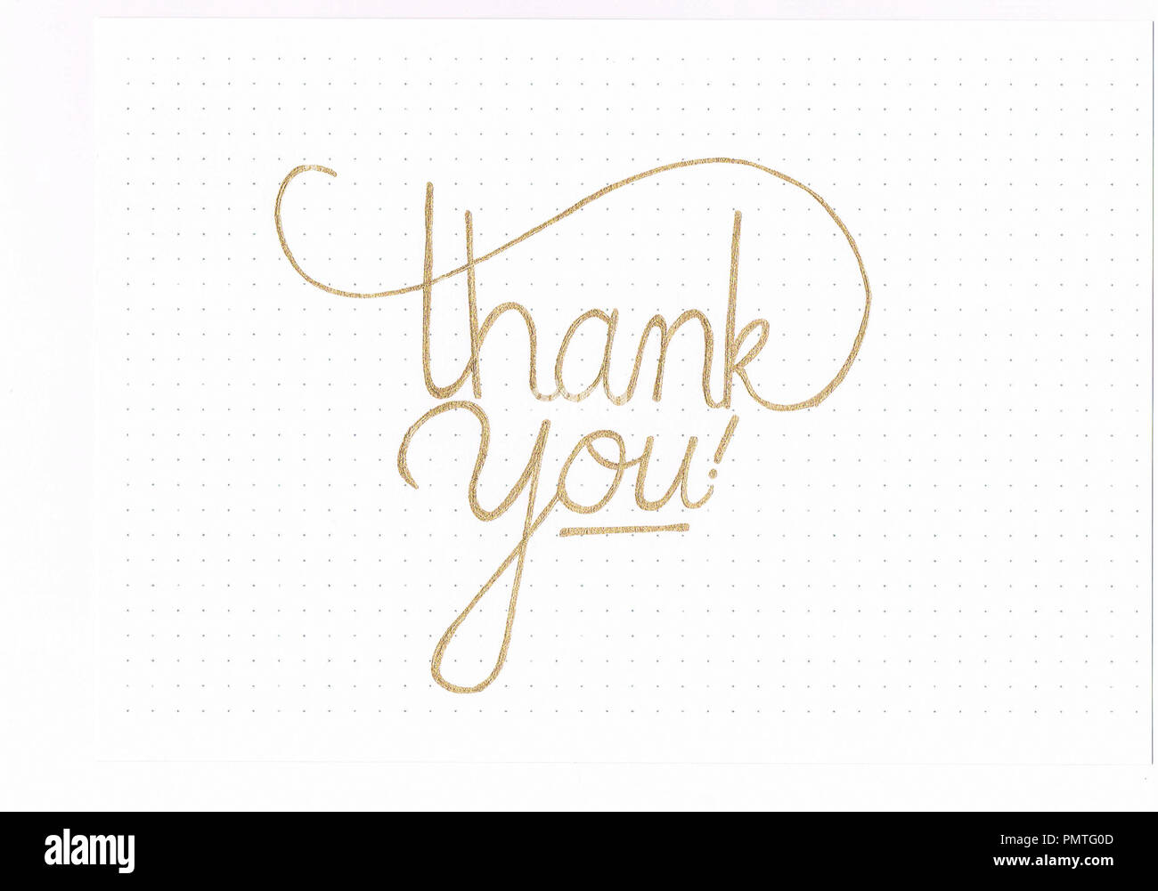 "Merci !" golden hand inscription lettrage Banque D'Images