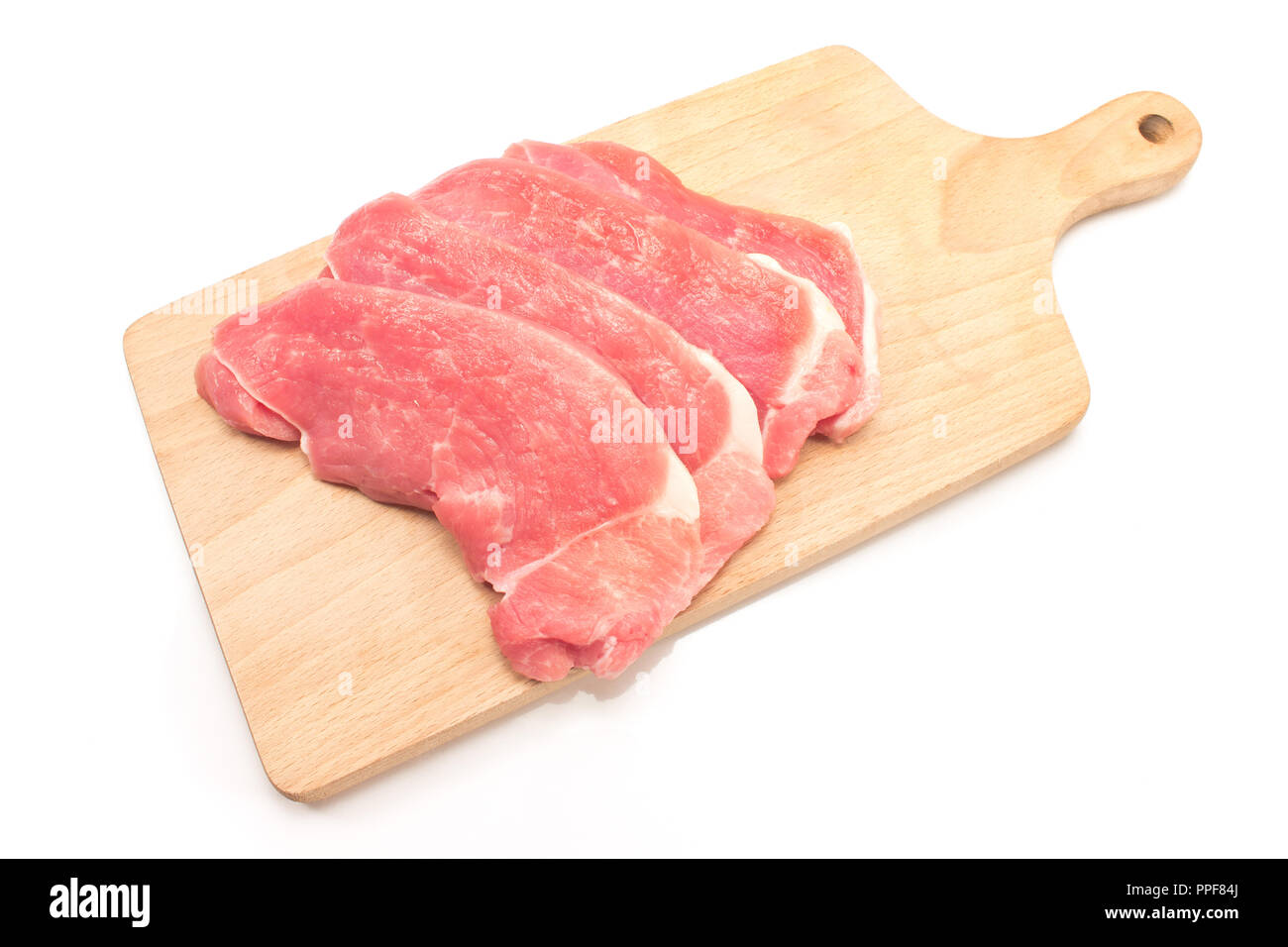 La viande de porc sur une planche à découper isolated on white Banque D'Images