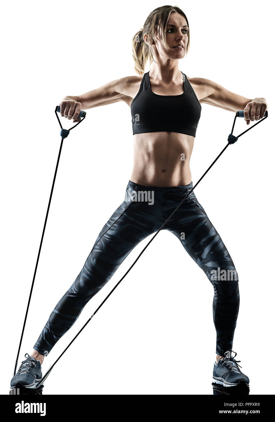 Un caucasian woman exercice fitness pilates exercices bande élastique résistant silhouette isolé sur fond blanc Banque D'Images