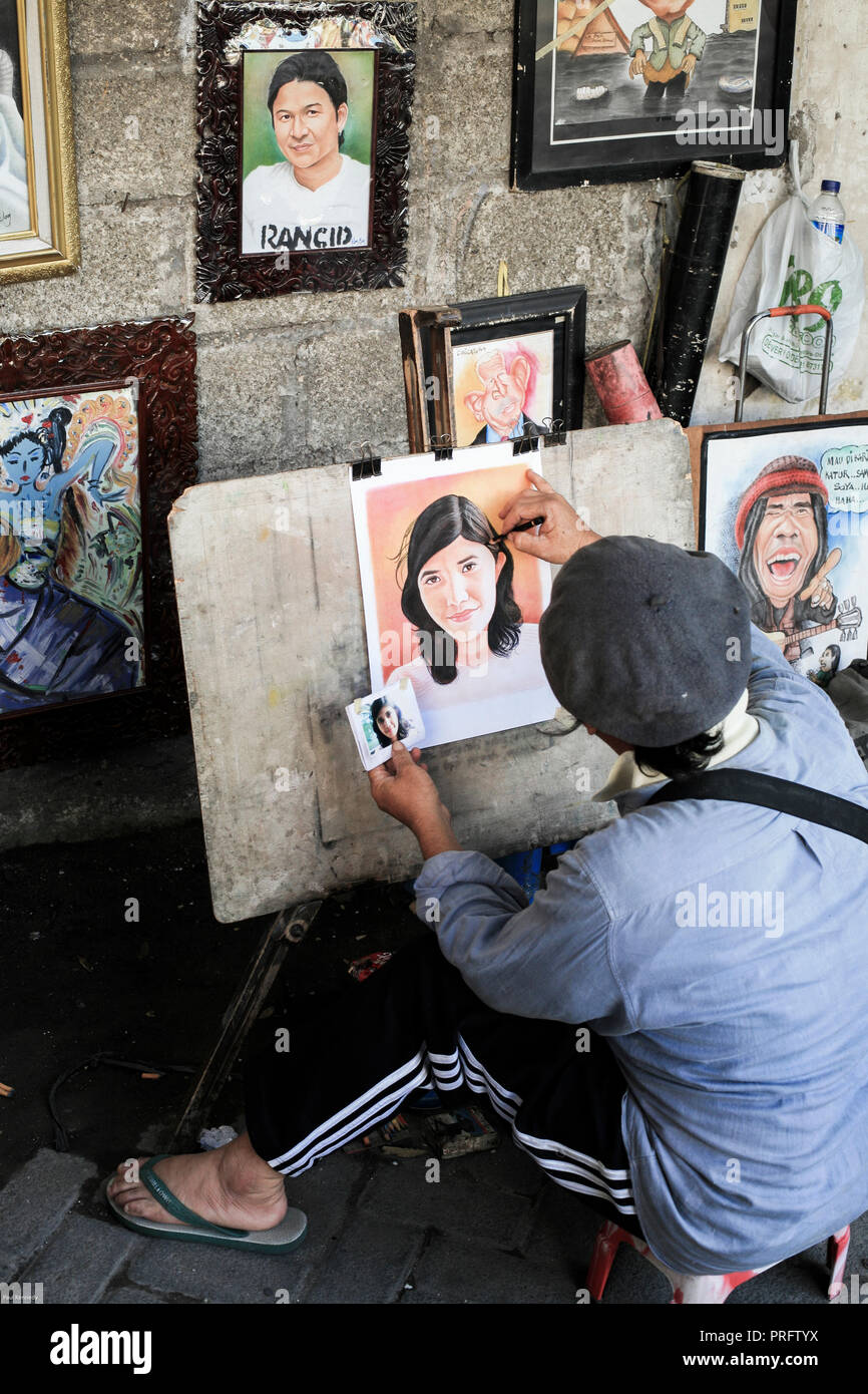 Peintre de portrait à l'œuvre dans les rues de la vieille Batavia, Jakarta, Indonésie Banque D'Images