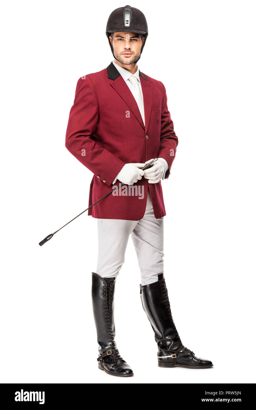 Beau jeune cavalier en tenue uniforme horseman stick and looking at camera isolated on white Banque D'Images