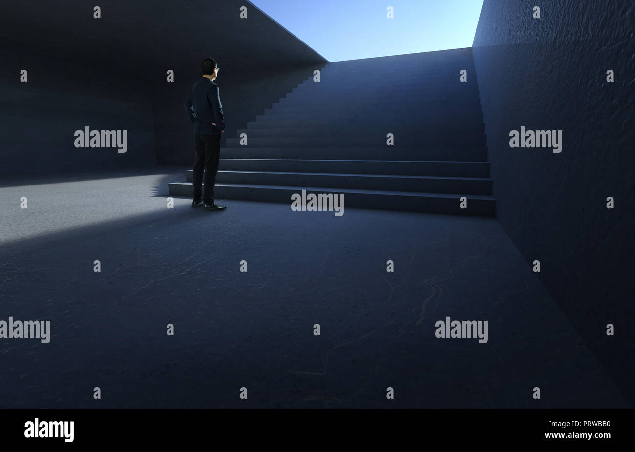 Businessman et de penser avant d'un escalier en béton dans l'underground. Banque D'Images