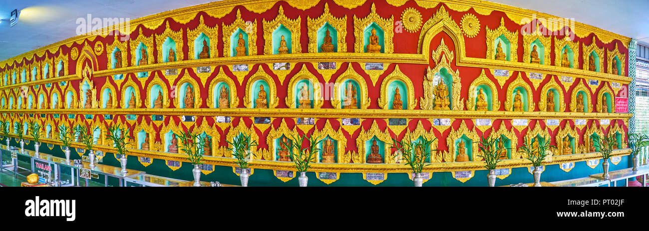 YANGON, MYANMAR - février 27, 2018 : Panorama de la mur avec des centaines de niches pittoresques et donnés à l'intérieur des images de Bouddha, Temple du Bouddha, Chaukhtatgyi Banque D'Images