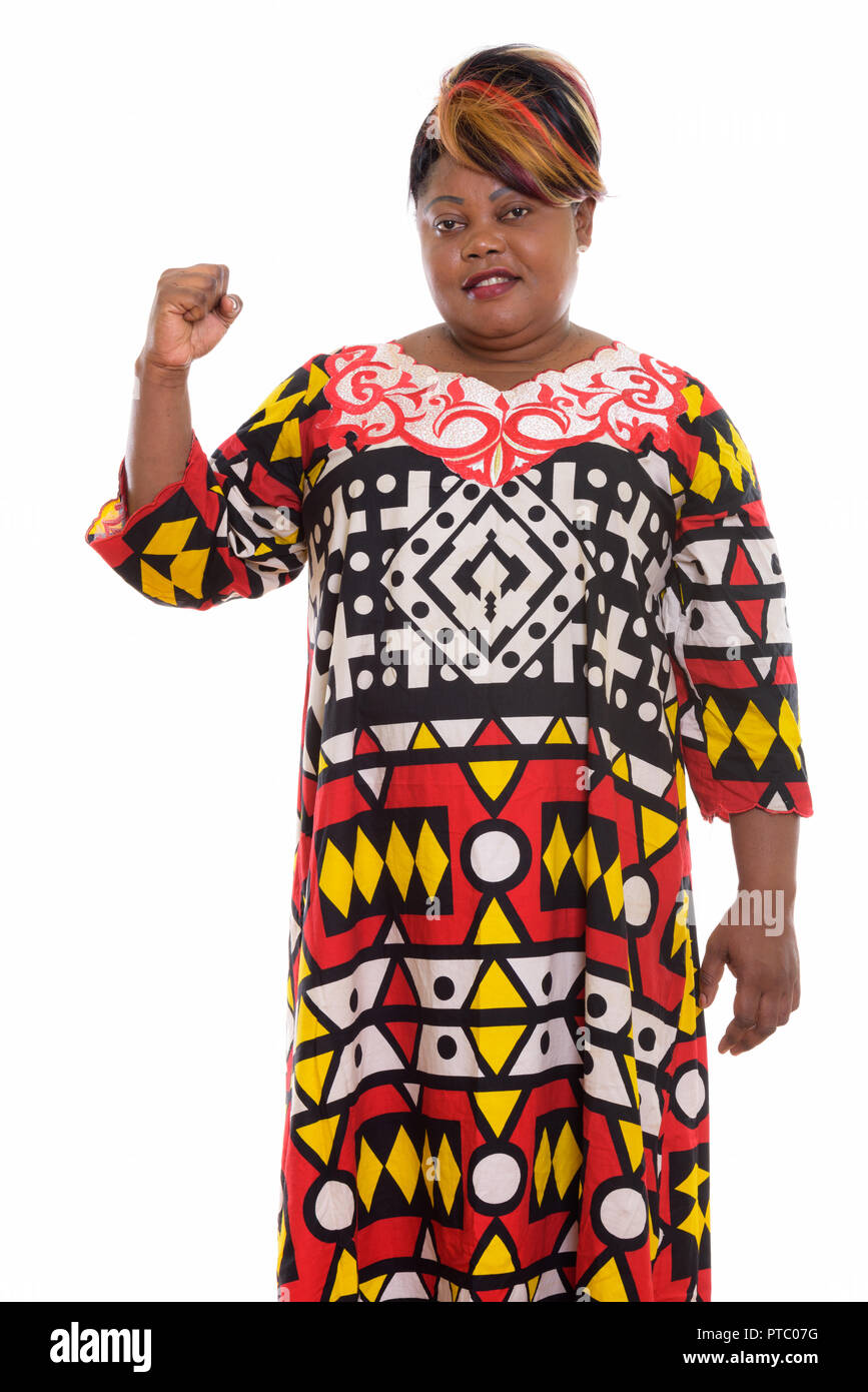 Studio shot of happy fat black African woman smiling et standin Banque D'Images