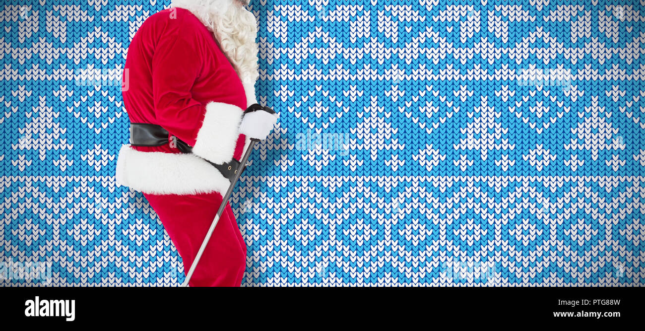 Image composite du père noël ski festif Banque D'Images